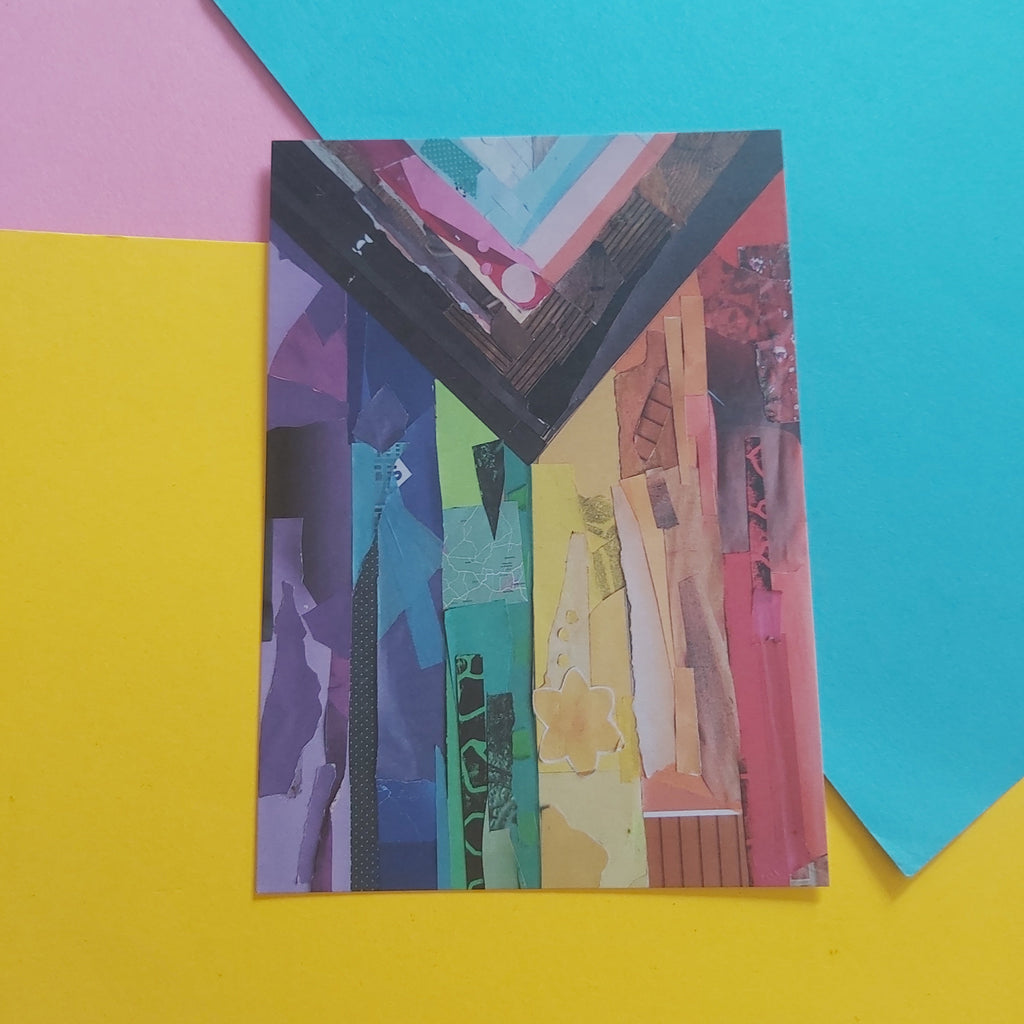 A rectangular art print with a colourful collage in purple, blue, green, yellow, pink, and black stripes in a progress pride pattern, styled on a background of pink, yellow, and blue paper.