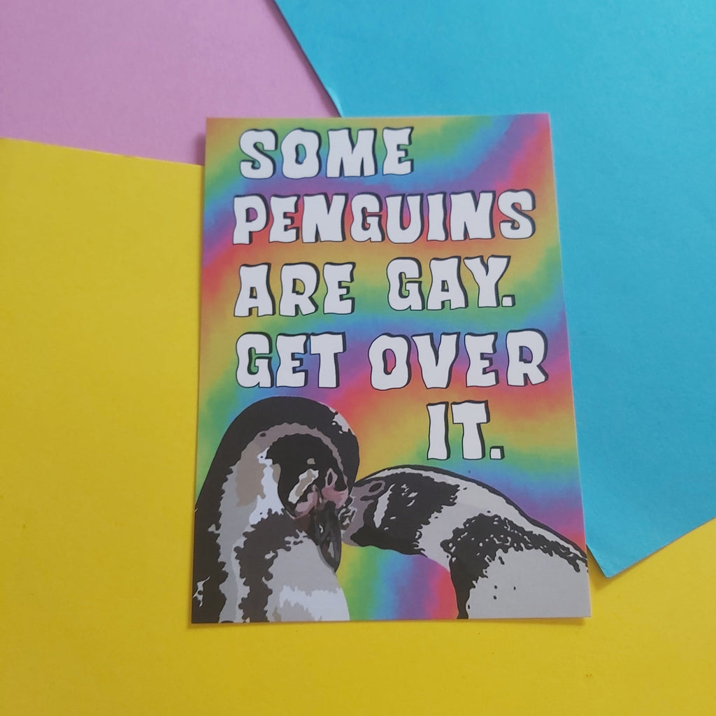 A rectangular print with a rainbow background and the text 'SOME PENGUINS ARE GAY. GET OVER IT.