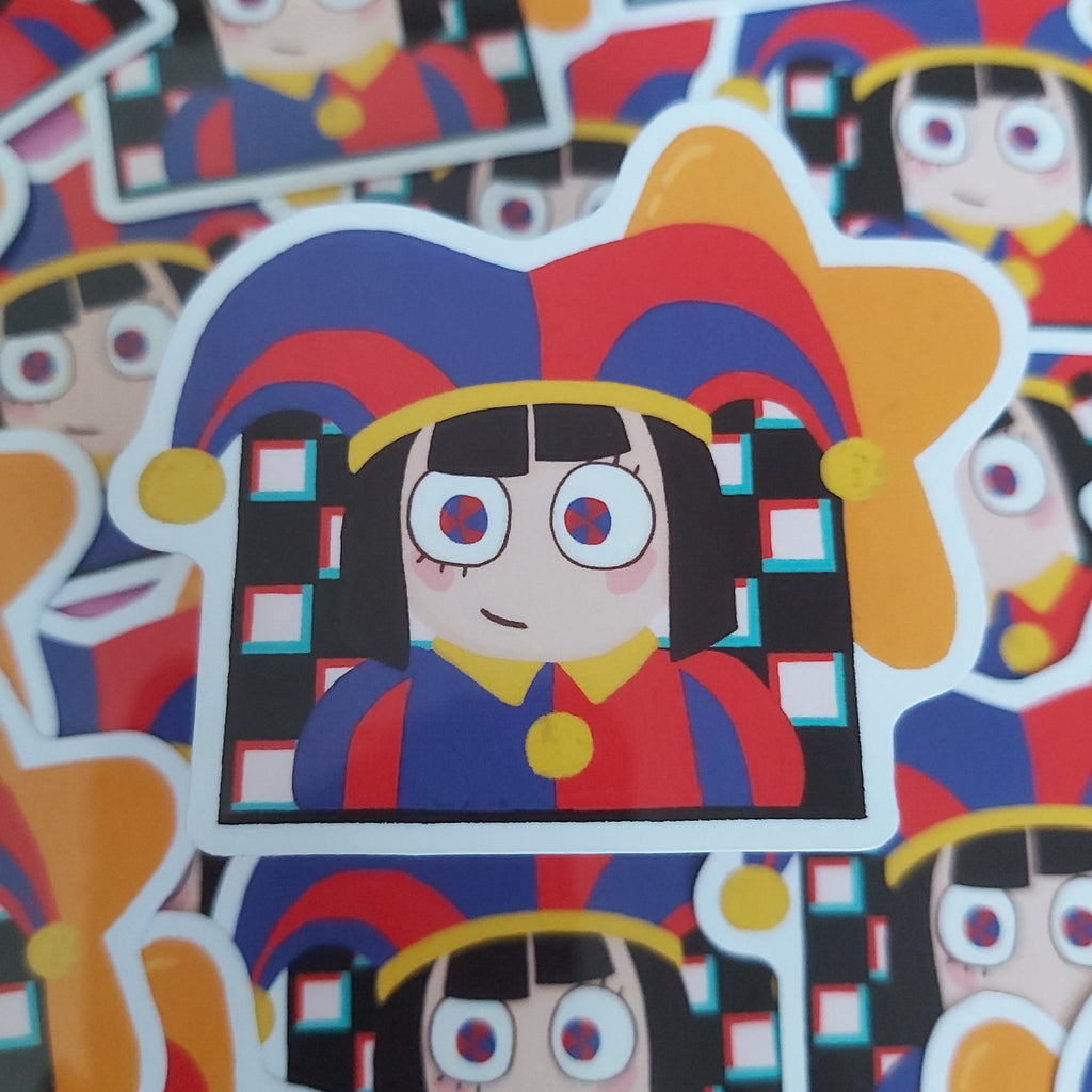 A close-up pile of die-cut stickers featuring a cartoon girl with large eyes, black hair, and a red-and-blue jester hat, with yellow star accents and a white border.