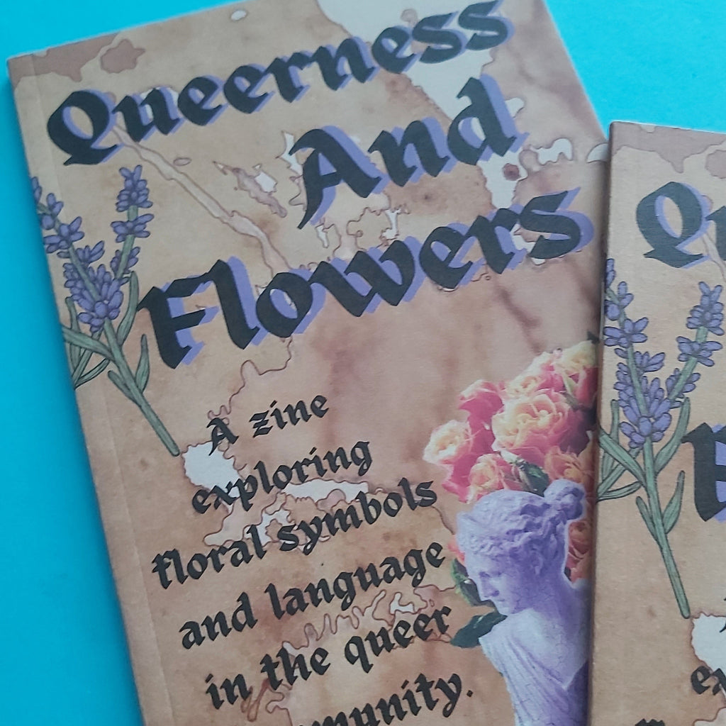 A close-up of a zine cover titled "Queerness And Flowers" on a bright turquoise background, with additional copies partially visible at the right edge.