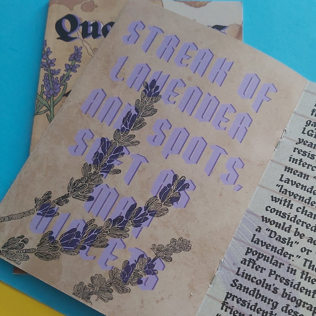 A close-up of zine pages with the phrase “STREAK OF LAVENDER AND SPOTS, SOFT AS MAY VIOLETS” in lavender-purple lettering over a tan background, with lavender illustrations and part of another printed page visible underneath.