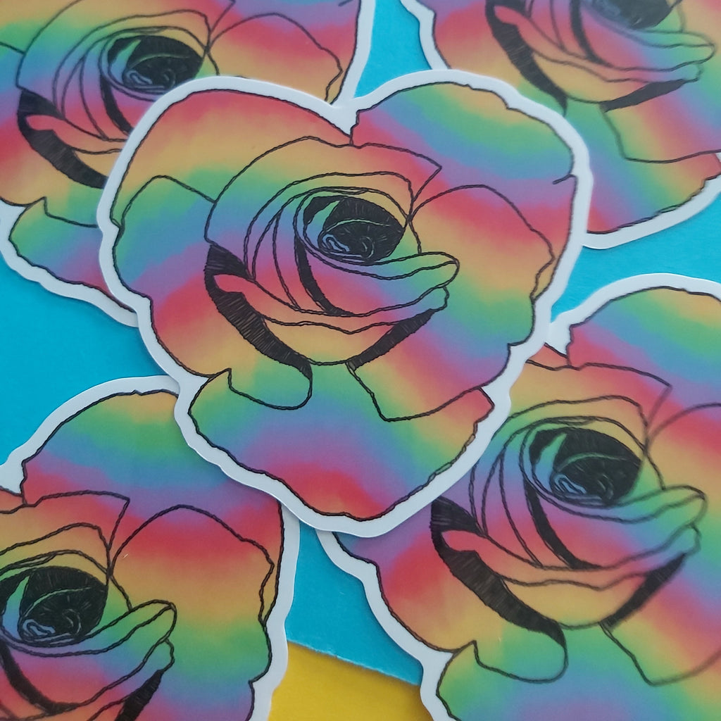 Five die-cut stickers featuring rainbow-colored roses with black outlines, arranged on a bright blue background.