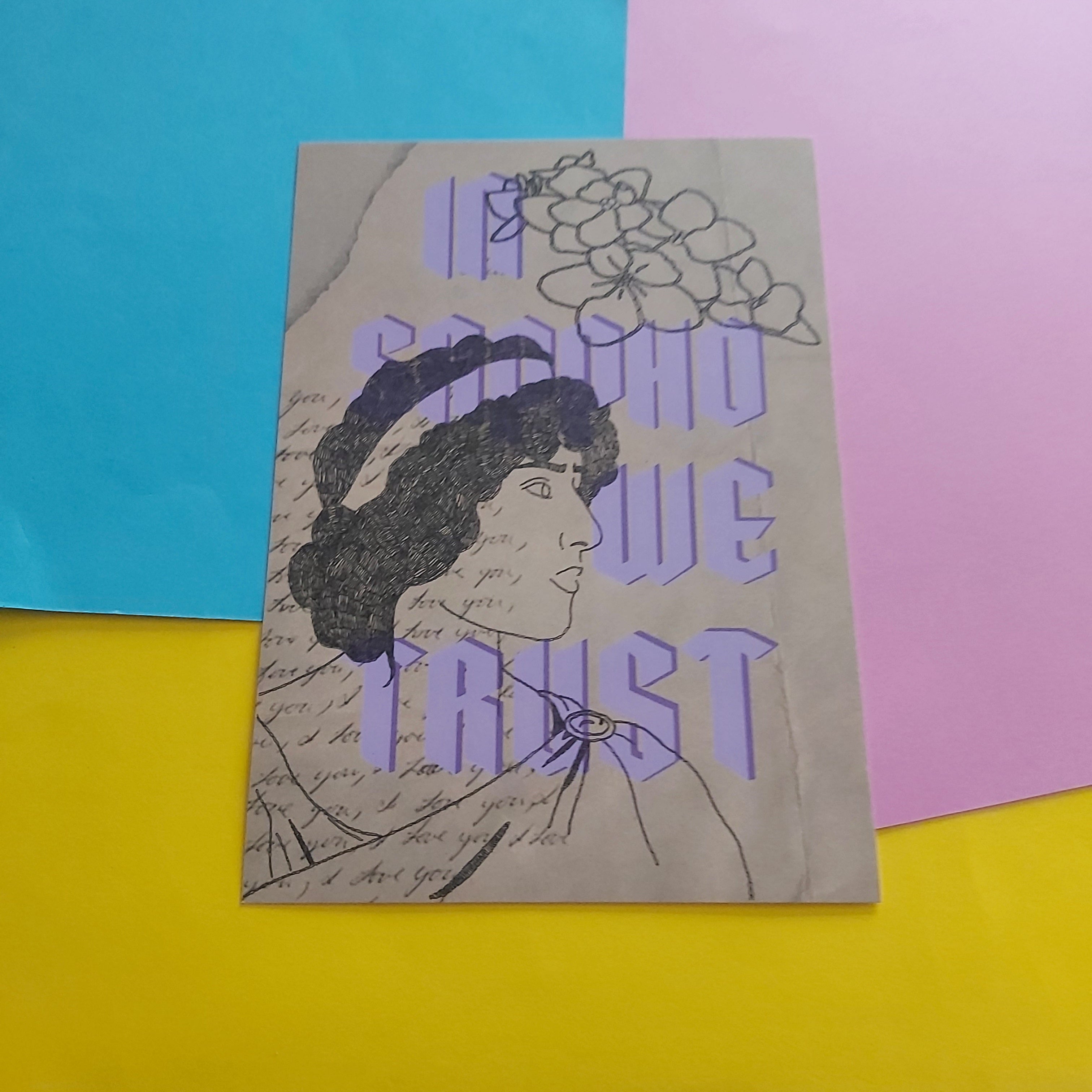 A vintage-style art print with the text 'IN SAPPHO WE TRUST' in purple over a sketch of a woman's profile and flowers, placed on a colourful background of blue, pink, and yellow sheets.