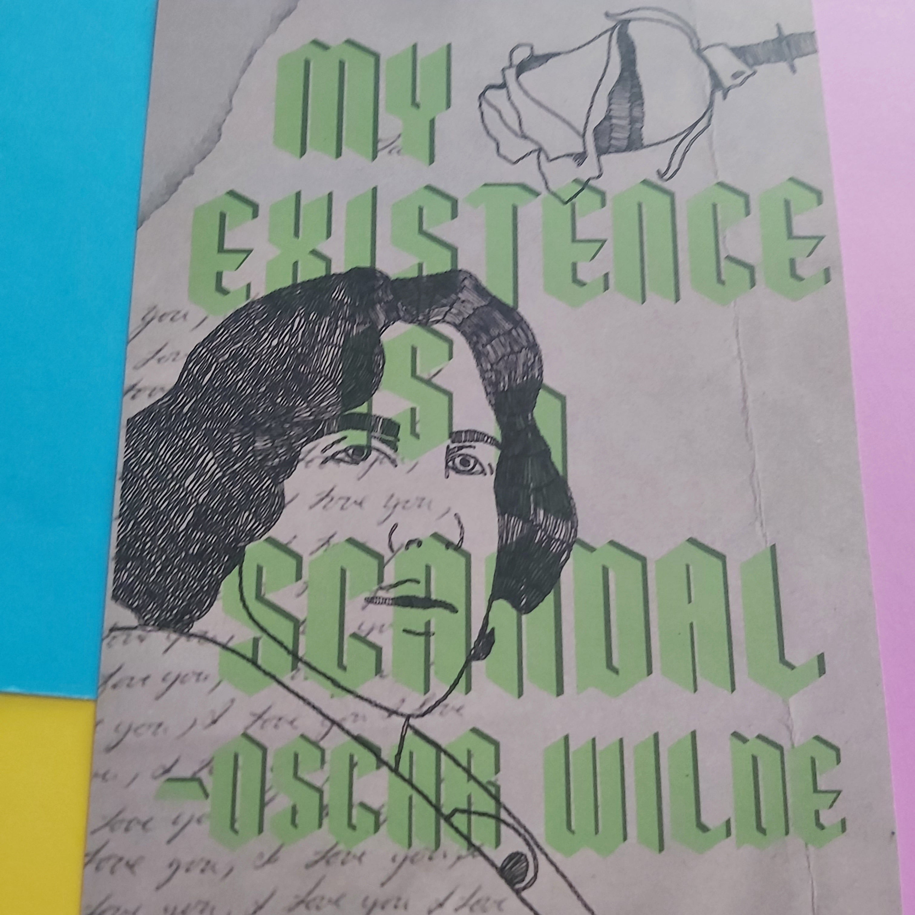 A print featuring a black sketch portrait of Oscar Wilde with the text 'MY EXISTENCE IS A SCANDAL -OSCAR WILDE' in light green lettering, placed on a bright multicolour background.