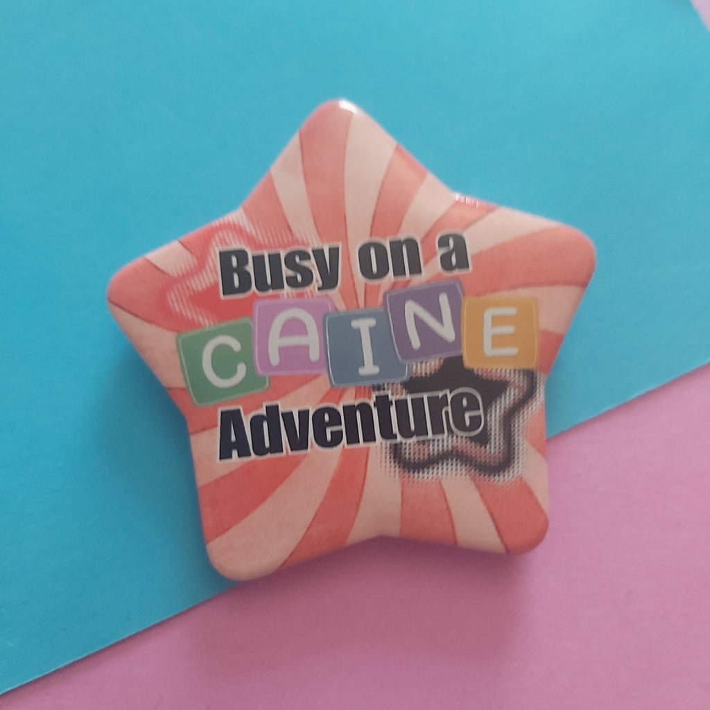 Busy on a Caine Adventure Star-Shaped 58mm Badge – TADC Digital Circus Clown Pin Accessory