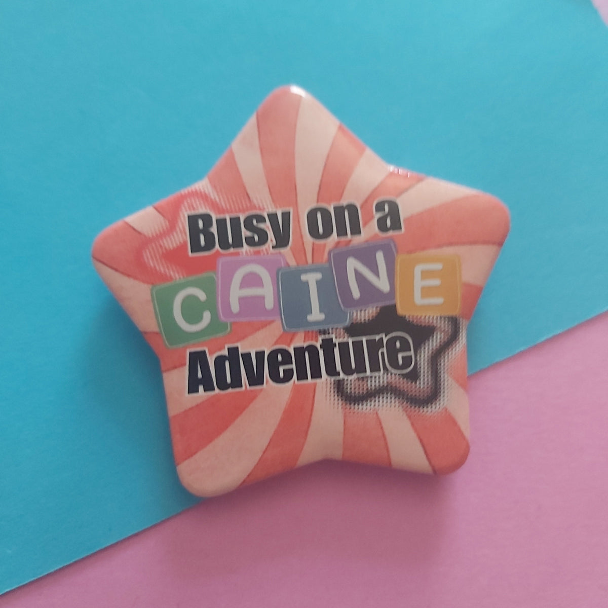 Busy on a Caine Adventure Star-Shaped 58mm Badge – TADC Digital Circus Clown Pin Accessory