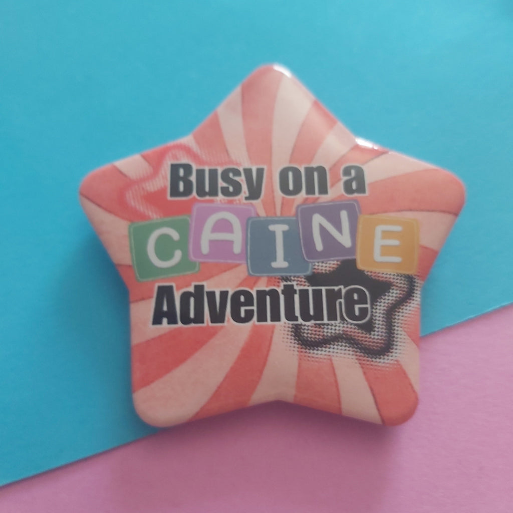 Busy on a Caine Adventure Star-Shaped 58mm Badge – TADC Digital Circus Clown Pin Accessory