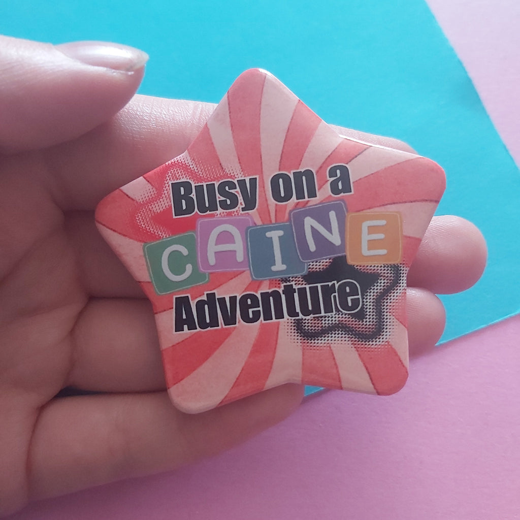 Busy on a Caine Adventure Star-Shaped 58mm Badge – TADC Digital Circus Clown Pin Accessory