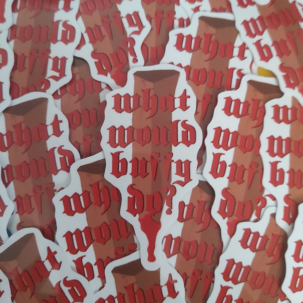 A close-up of multiple die-cut stickers featuring the phrase 'what would buffy do? in red gothic lettering on a white outline, layered over a brown illustrated stake.