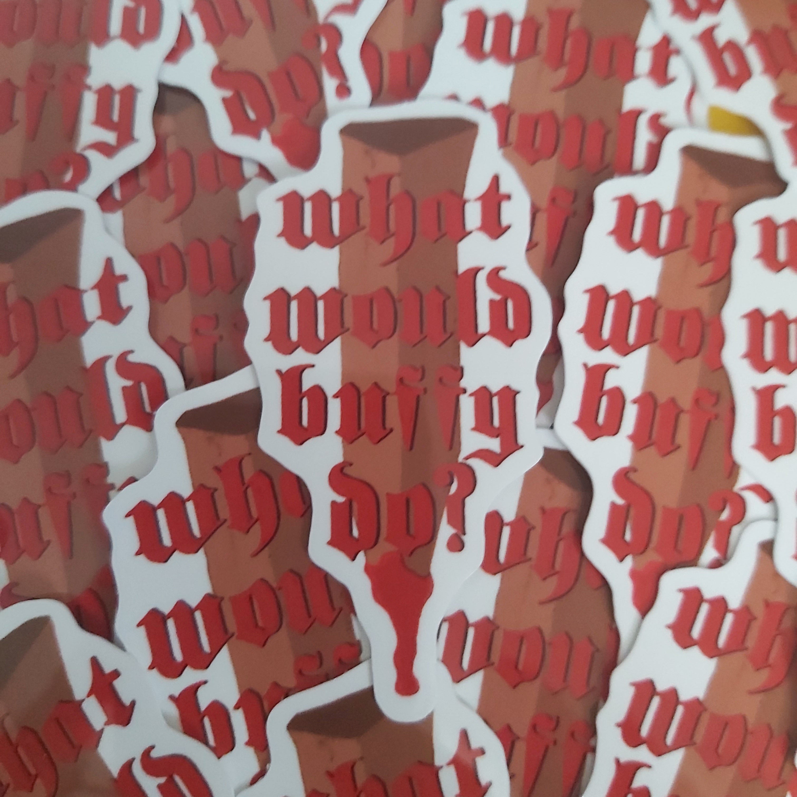 A close-up of multiple die-cut stickers layered on top of each other. Each sticker features the phrase 'what would buffy do?' in a red Gothic/Old English font over a brown and beige illustrated wooden stake.