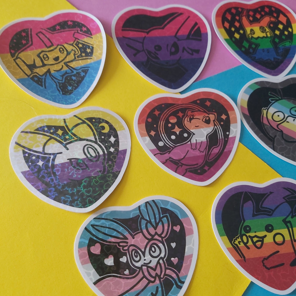 A set of heart-shaped stickers featuring various colorful cartoon characters, arranged on a background split diagonally between yellow and pink paper.