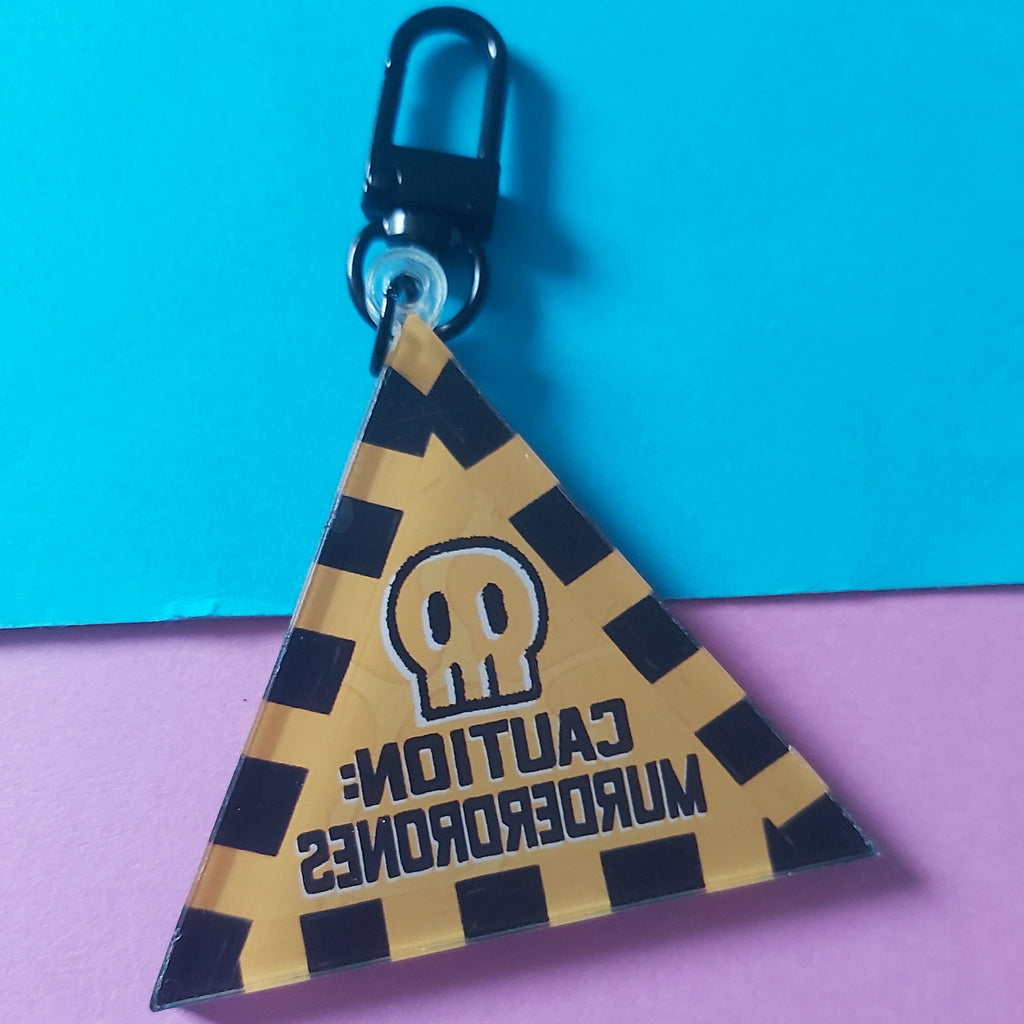 B-Grade Caution Murderdrones Yellow and Black Triangle Warning Sign Keychain – Double-Sided Acrylic Charm
