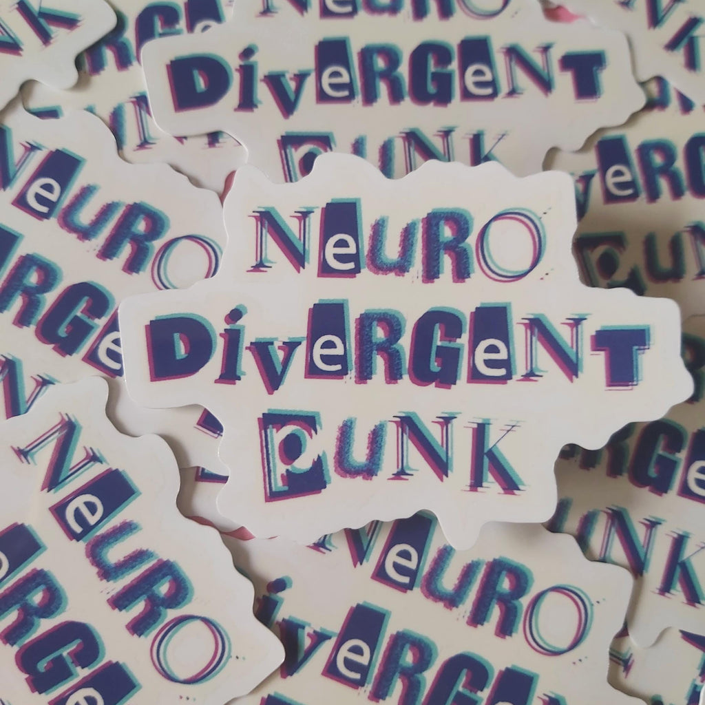 A pile of die-cut stickers featuring the text 'Neuro Divergent Punk' in a stylised purple and blue 3D-effect font on a white background.