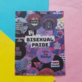 A print featuring various bisexual pride-themed imagery and text, displayed on a diagonally split pastel blue, yellow, and pink background.
