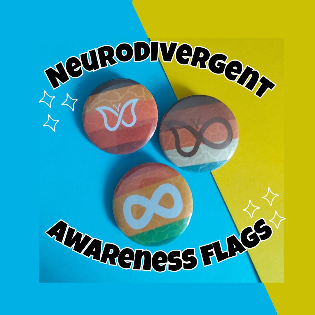 Three round pin-back buttons with colourful gradient flag designs and white awareness symbols, displayed on a bright blue and yellow background with bold text reading 'Neurodivergent Awareness Flags'.