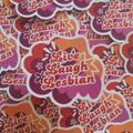 A close-up pile of die-cut stickers featuring the phrase 'Live Laugh Lesbian' in red script over a retro cloud and starburst design in orange, pink, and purple with white outlines.