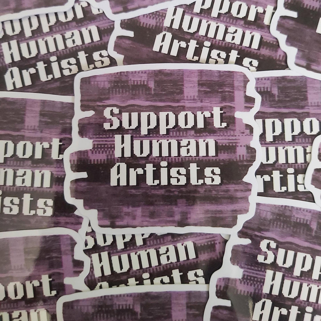 A close-up of multiple die-cut stickers with the phrase 'Support Human Artists' in white text over a textured purple and black background, arranged with overlapping matching stickers.